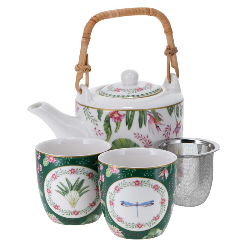 A teapot with bamboo handle, stainless steel strainer, and 2 small cups in front. All elements are decorated in green with pink flowers and dragonflies
