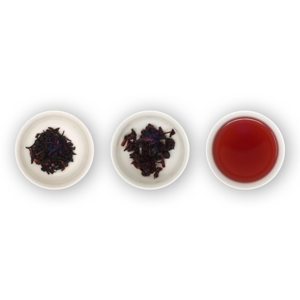 Three circular bowls with samples of herbal tea. The first bowl shows dry loose berries and flower petals, the second bowl shows the tea leaves after brewing, and the third bowl shows the red brewed tea liquid.
