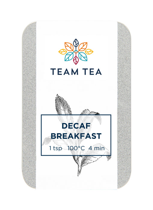 A tin containing loose-leaf decaffeinated black tea with a white label and a botanical sketch of a tea plant.