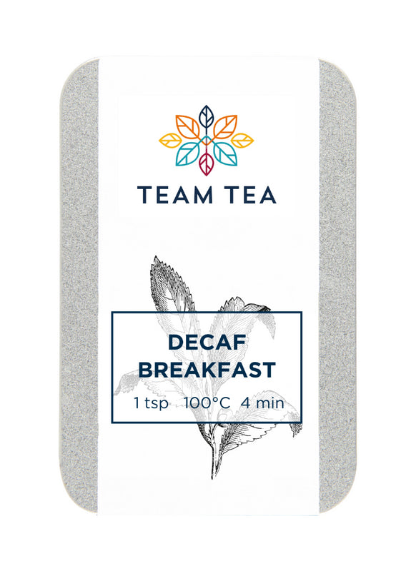 A tin containing loose-leaf decaffeinated black tea with a white label and a botanical sketch of a tea plant.