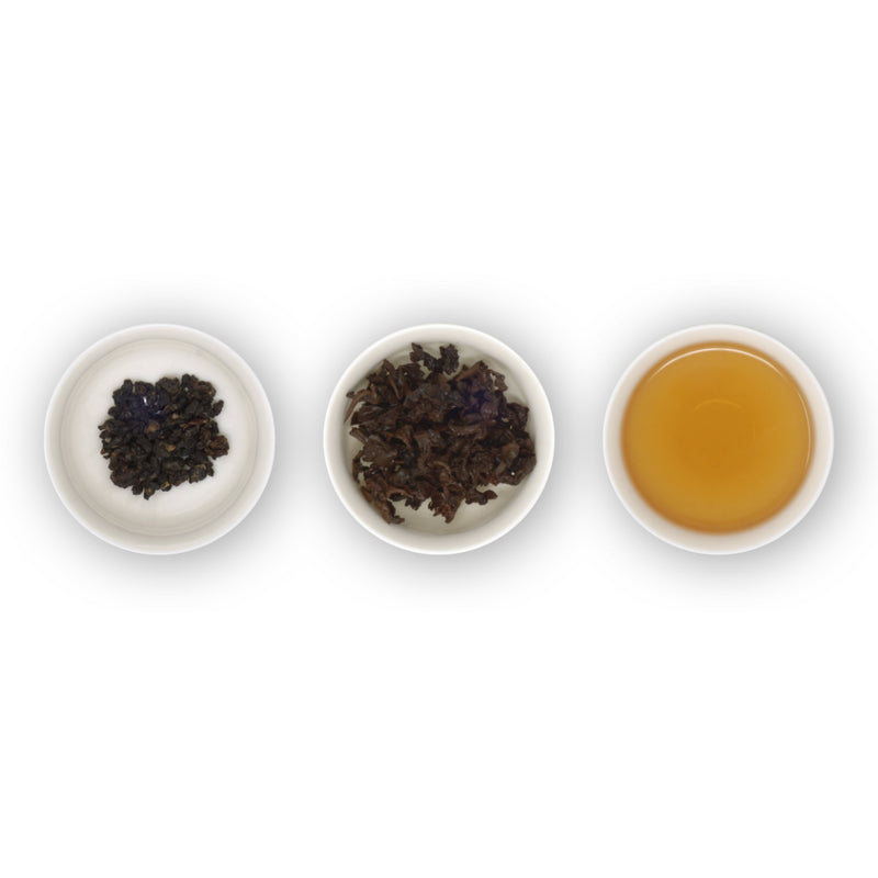 Three circular bowls arranged in a row, showing loose tea leaves on the left, brewed tea leaves in the middle, and the resulting amber-colored tea liquid on the right.