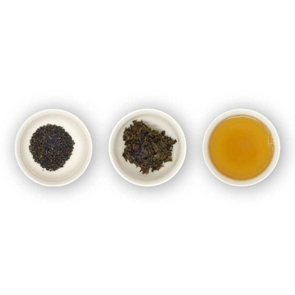 Three circular bowls with Gunpowder green tea leaves and the brewed tea in a cup, indicating the product is a green tea from China.