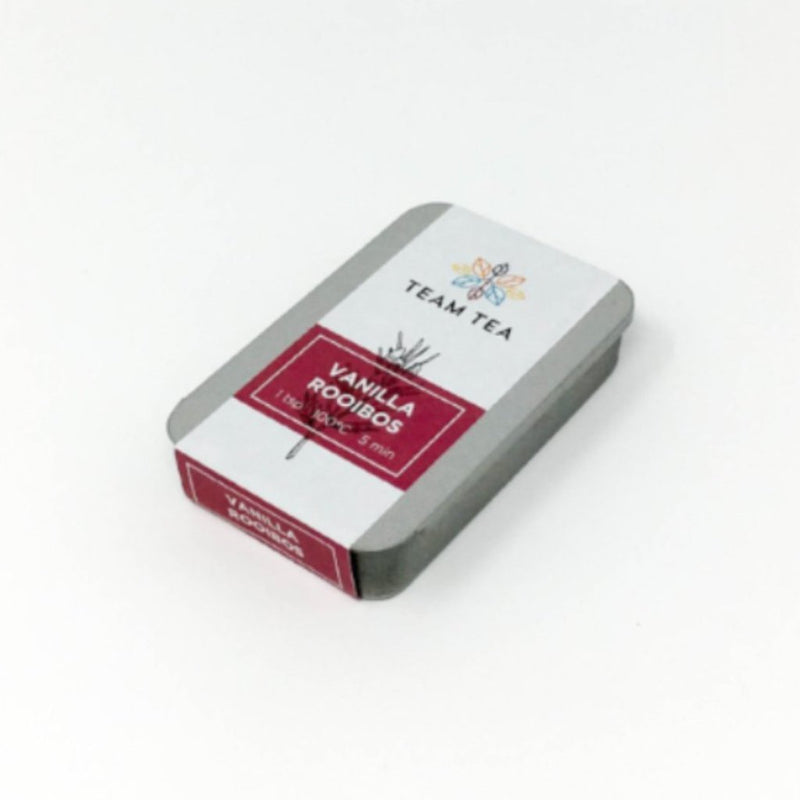 A metal tin with a red paper label that reads Vanilla Rooibos. The tin contains loose leaf Rooibos
