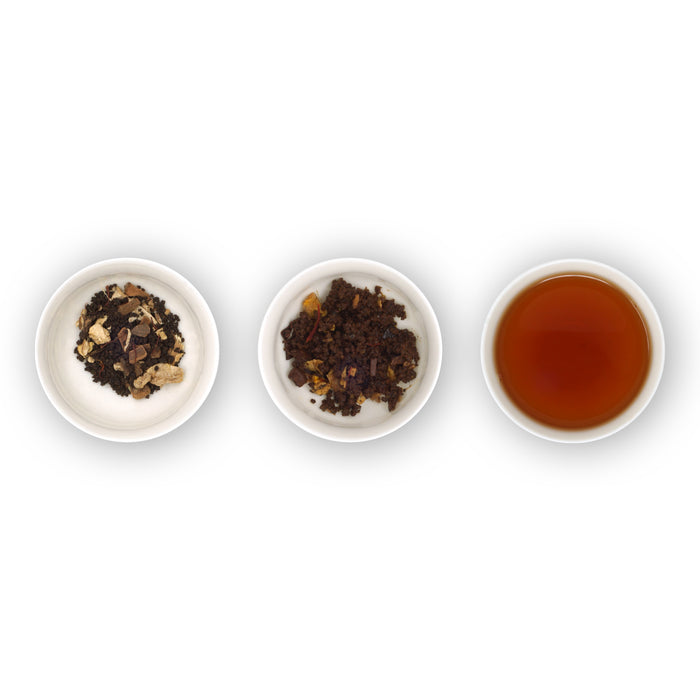 Three white bowls containing dry tea (chai) leaves and spices, and one bowl with brewed tea