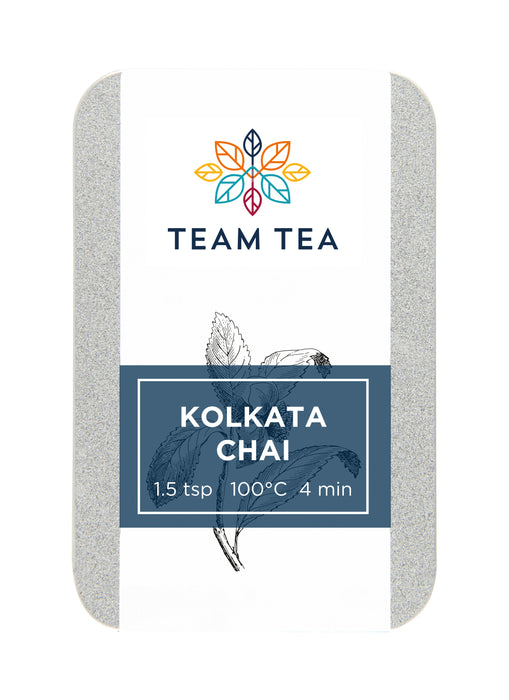 A metal tin of spiced chai loose-leaf tea with a navy blue label and botanical inspired sketch