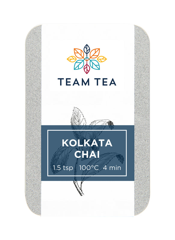 A metal tin of spiced chai loose-leaf tea with a navy blue label and botanical inspired sketch