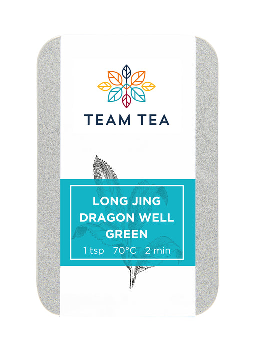 A silver metal tin with turquoise label and drawing of tea plant. The tin reads Long Jing Dragon Well Green and contains loose-leaf green tea from China.