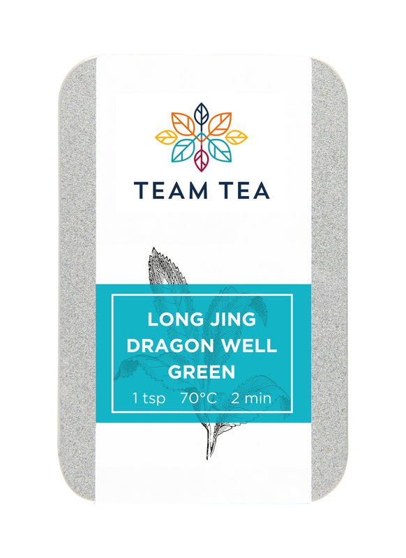 A silver metal tin with turquoise label and drawing of tea plant. The tin reads Long Jing Dragon Well Green and contains loose-leaf green tea from China.