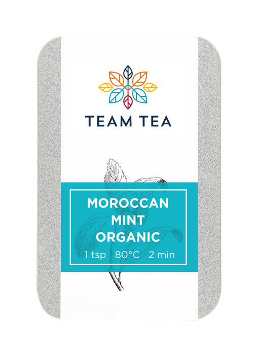 A metal tin on a white back ground. The tin contains loose-leaf green tea from China and Moroccan Mint. There is a turquoise label and brand logo