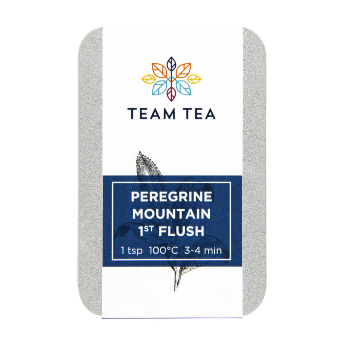A slide tin of Peregrine Mountain 1st Flush on a white background