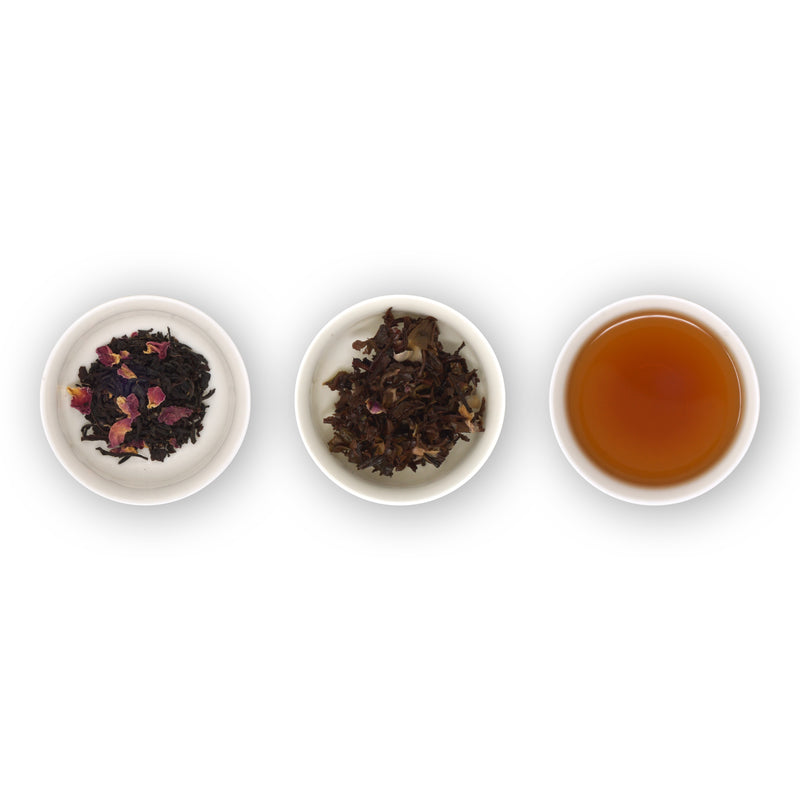 Three circular bowls with samples of black tea with rose petals. The first bowl shows dry loose tea leaves, the second bowl shows the tea leaves after brewing, and the third bowl shows the brewed tea liquid.
