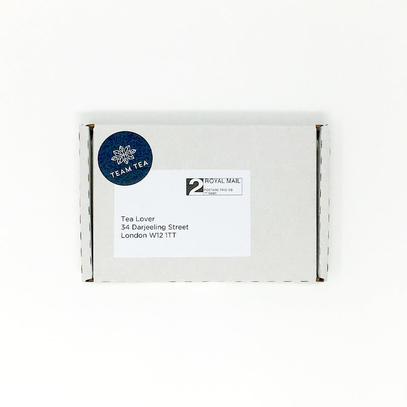 A close up of a branded white rectangular cardboard box