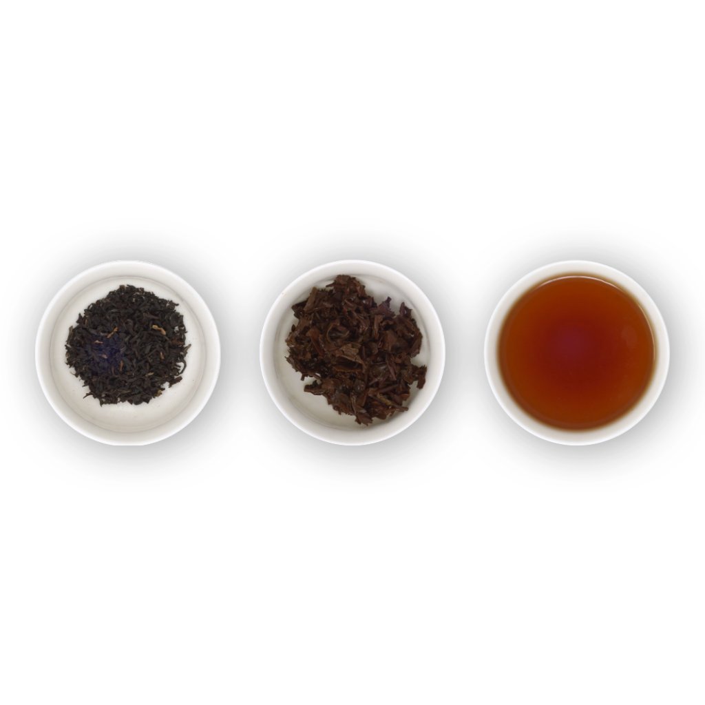 Three circular bowls arranged in a row, with the left bowl showing dry black tea leaves, the middle bowl showing brewed black tea leaves, and the right bowl showing a cup of brewed black tea with a dark amber colour.