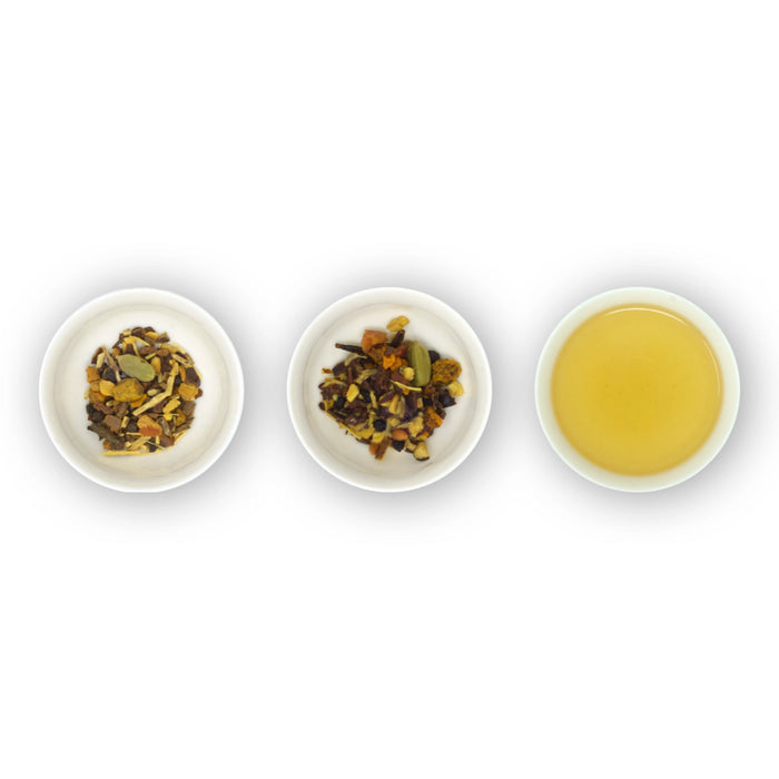 Three white bowls containing loose tea leaves and spices, and a cup with brewed turmeric tea