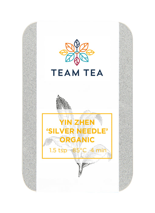 A small metal tin against a white background. The tin contains Organic loose-leaf white tea from China.