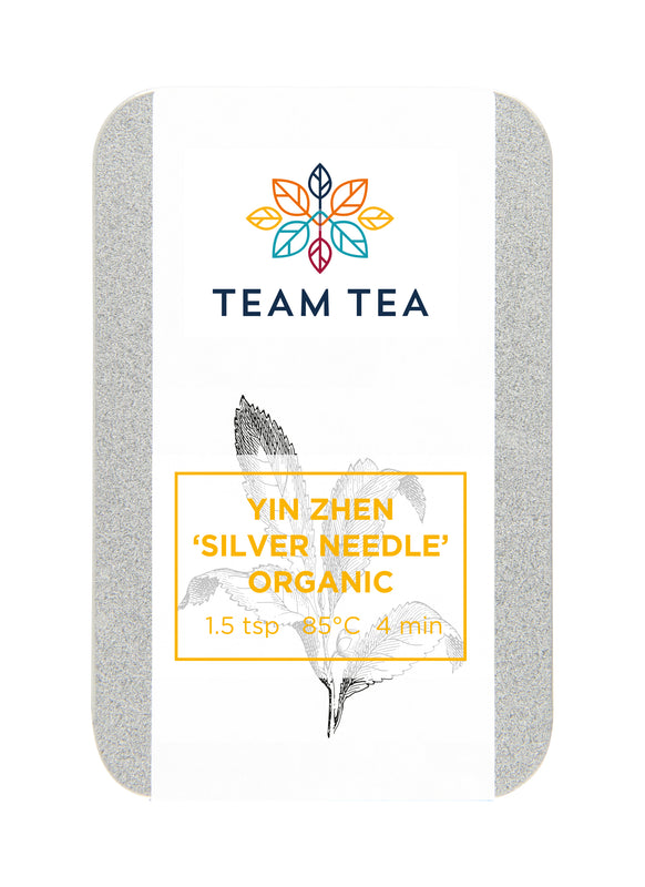 A small metal tin against a white background. The tin contains Organic loose-leaf white tea from China.