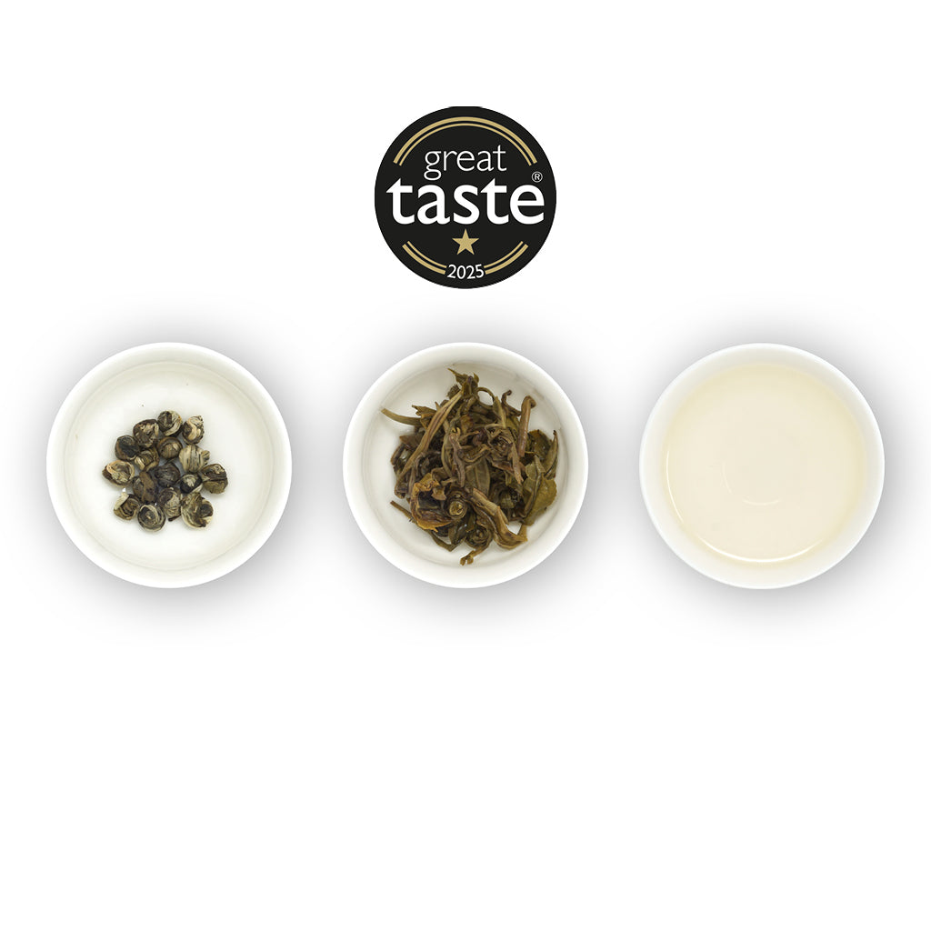 Three bowls with tea leaves and a 'Great Taste' award on a white background