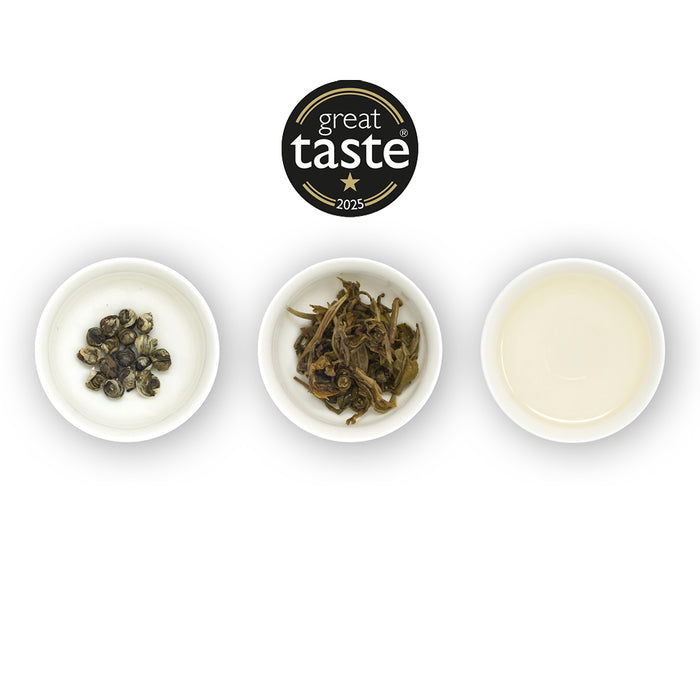 Three bowls with tea leaves and a 'Great Taste' award on a white background