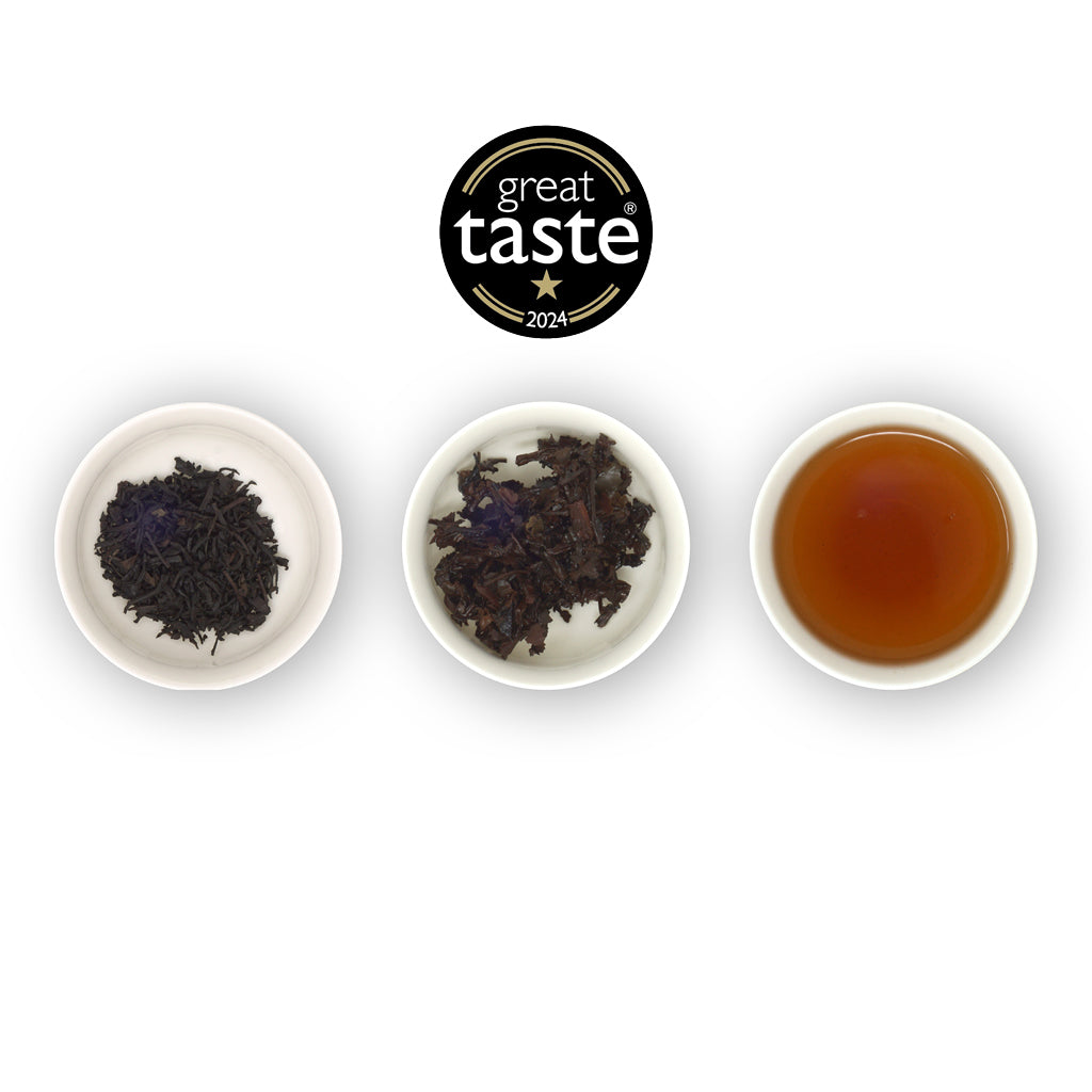 3 small white ramekins showing loose leaf lapsang, dry, wet and then the brewed tea. Above is the 2024 Great Taste Award 1-star logo. All on white background.